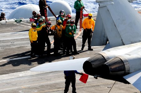 US Navy 111207-N-RG587-153 Sailors fight a simulated fire on an F-A-18C Hornet on the flight deck aboard the Nimitz-class aircraft carrier USS Carl