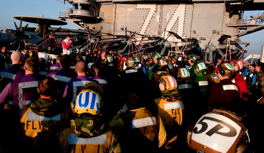 US Navy 111207-N-OY799-384 Sailors review safety precautions prior to drills on the flight deck of the Nimitz-class aircraft carrier USS John C. St