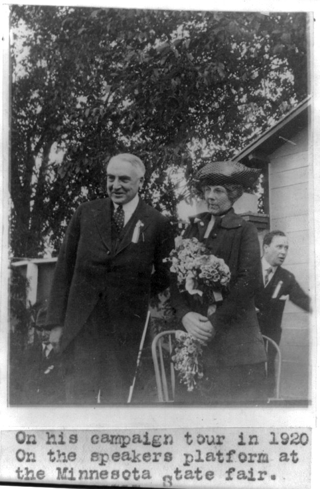 Warren Gamaliel Harding; three-quarters length, standing with wife on platform at Minnesota State Fair, 1920 campaign LCCN2007683064