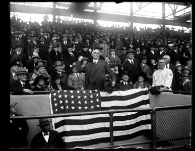 Warren Harding throwing baseball at Washington game LCCN2016894389