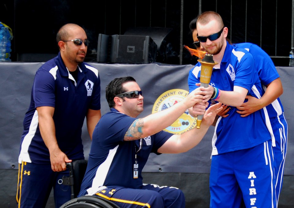 Warrior Games participants pass the torch during the opening ceremony of the 2015 Department of Defense Warrior Games. (19034031876)