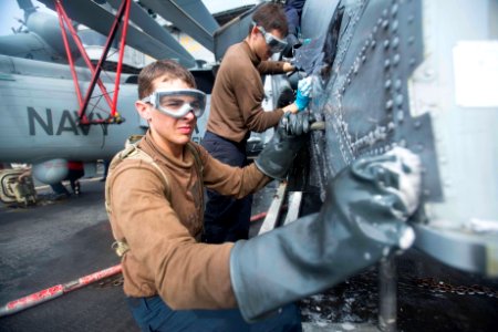 Washing an MH-60S Sea Hawk helicopter 130908-N-ZG705-236
