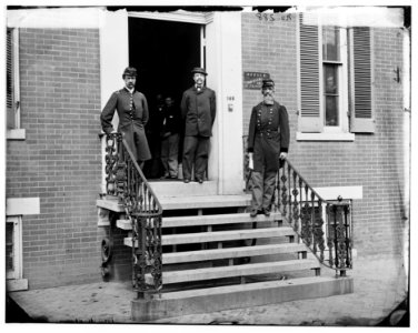 Washington, D.C. Gen. William Hoffman, Commissary General of Prisoners (at right) and staff on steps of office, F. St. at 20th NW LOC cwpb.03953