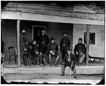Washington, D.C. Maj. Gen Alexander M. McCook (center) and staff on porch of quarters, Brightwood (7th Street Road near present Sheridan St. LOC cwpb.04115