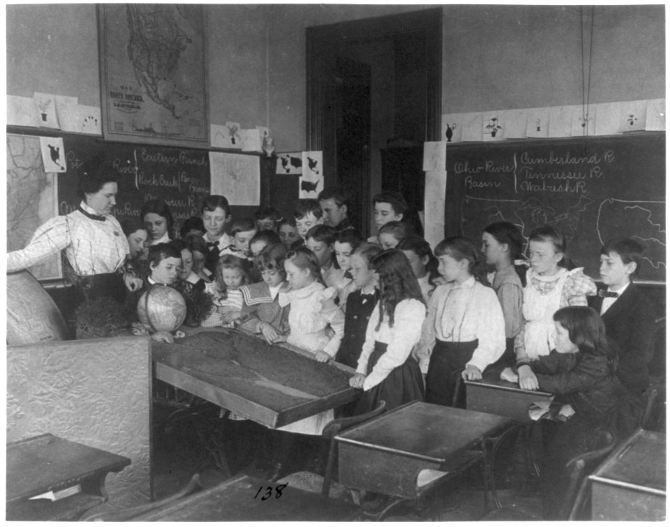 Washington, D.C. public school classroom scenes - 1st Division geography class - students examining relief map LCCN2001703689
