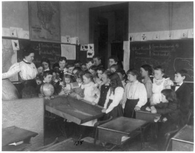 Washington, D.C. public school classroom scenes - 1st Division geography class - students examining relief map LCCN2001703689