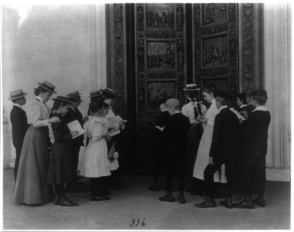 Washington, D.C. school children on field trip - examining the bronze Columbus door in the Capitol Rotunda LCCN2001703654