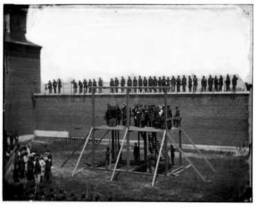 Washington, D.C. The four condemned conspirators (Mrs. Surratt, Payne, Herold, Atzerodt), with officers and others on the scaffold; guards on the wall LOC cwpb.04227