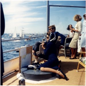 Watching the America's Cup Race. Mrs. Kennedy, President Kennedy, others. Off Newport, RI, aboard the USS Joseph P.... - NARA - 194214 photo