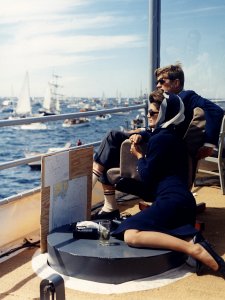 Watching the America's Cup Race. Mrs. Kennedy, President Kennedy. Off Newport, RI, aboard the USS Joseph P. Kennedy, Jr photo