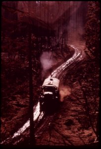 Water-truck-is-used-to-dampen-down-thick-carpet-of-soot-and-ashes-september-1973 7153129137 o