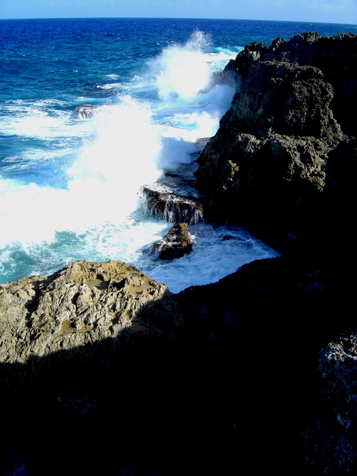 Waves crashing against the Guam shoreline (line381445909)