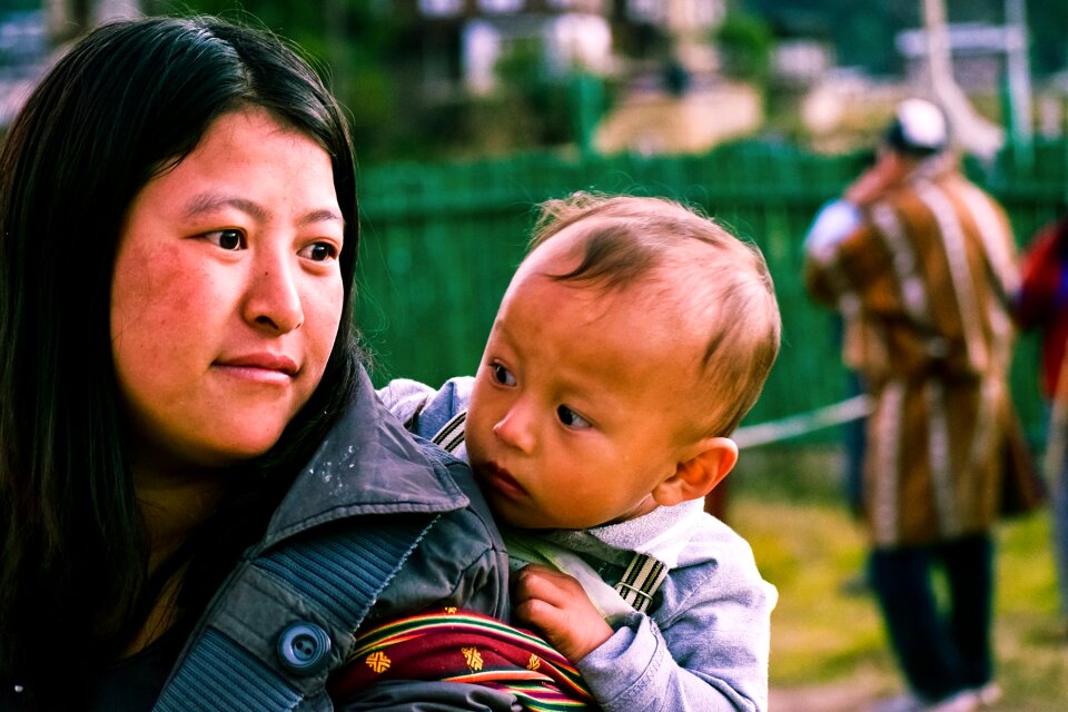 Mother carrying kid bhutan mother holding kid