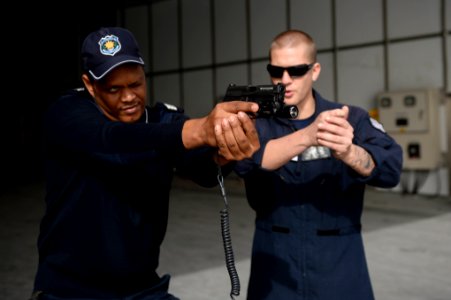 Weapons-handling drills 150114-N-RB579-100