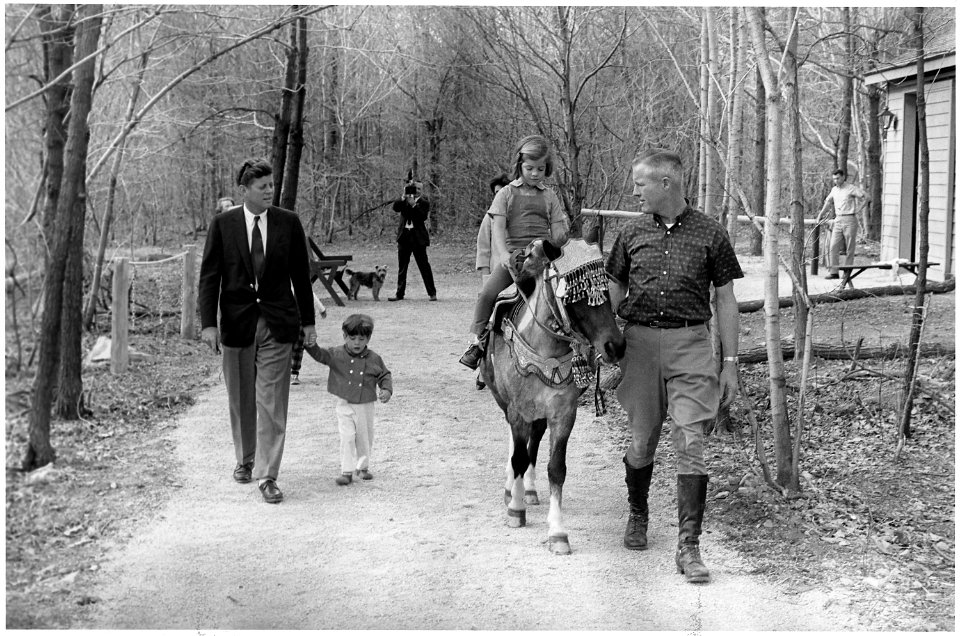 Weekend at Camp David. President Kennedy, John F. Kennedy, Jr., Caroline Kennedy ( riding Tex ). Camp David, MD. - NARA - 194194