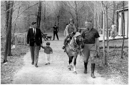 Weekend at Camp David. President Kennedy, John F. Kennedy, Jr., Caroline Kennedy ( riding Tex ). Camp David, MD. - NARA - 194194 photo