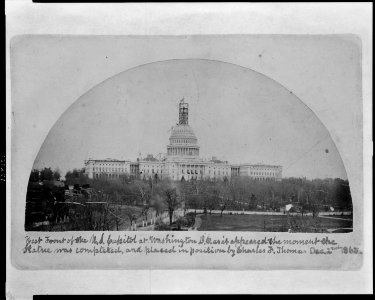 West front of the U.S. Capitol at Washington, D.C., as it appeared the moment the statue was completed, and placed in position by Charles F. Thomas LCCN2008680976