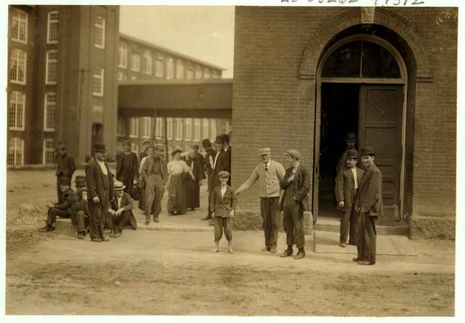 While I was photographing these workers (Berkshire Mills) the watchman dragged out the smallest boy, saying, 'Here, photograph 'Peewee'.' LOC cph.3a47665