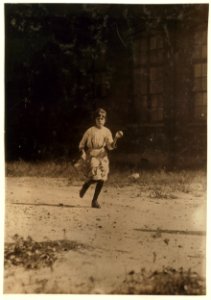 Whistle blows noon Opelika Cotton Mill. Smallest girl in photograph is Velma Smith a tiny little spinner with a steady job all day. I found her at home crying bitterly because her father LOC cph.3b31142