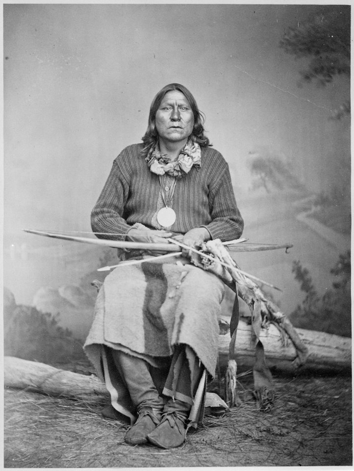 White Bear (Sa-tan-ta), a Kiowa chief, full-length, seated, holding bow and arrows, 1869 - 1874 - NARA - 518901