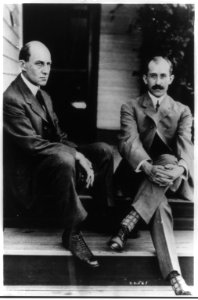 Wilbur Wright and Orville Wright seated on steps of rear porch, 7 Hawthorne St., Dayton, Ohio LCCN2003680184