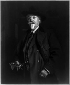 William Frederick Cody, 1846-1917, half length portrait, standing, facing slightly left, wearing overcoat, holding gloves LCCN2006677989