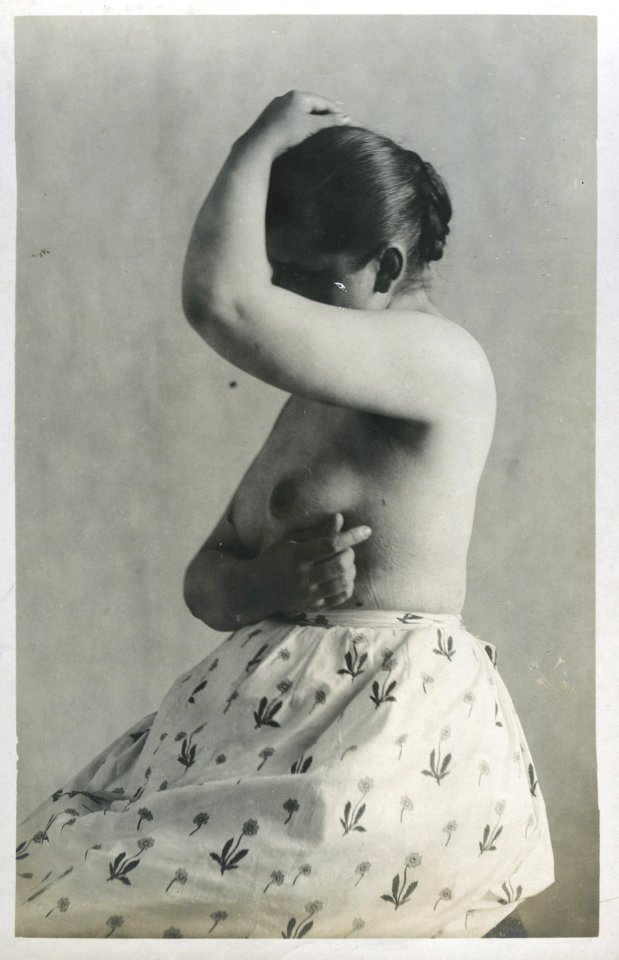 William Goldman, untitled (prostitute in brothel, wearing skirt with flowers), 1892-1900, vintage gelatin silver print, 14 x 8.9 cm