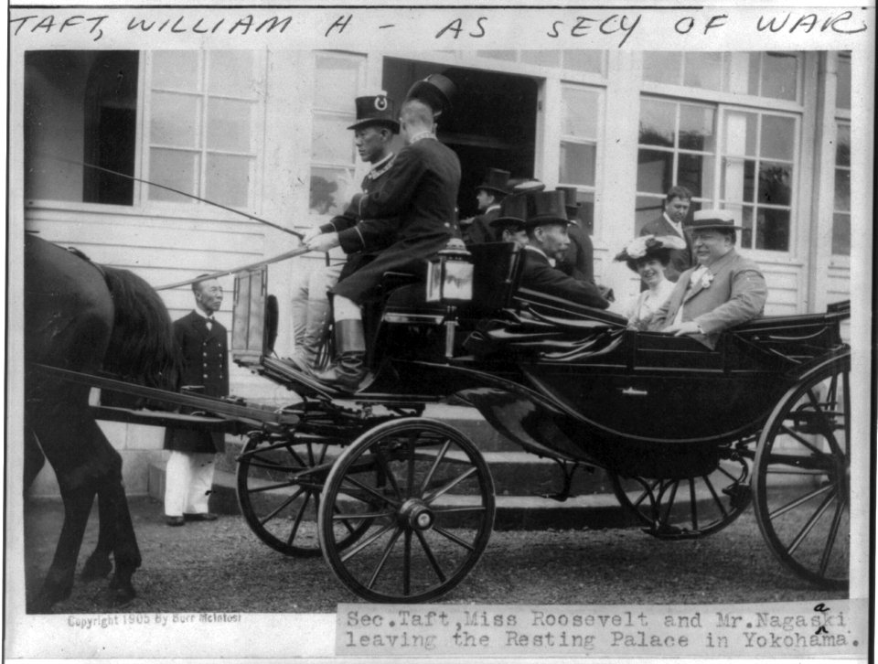 William H. Taft, half length, seated in carriage with Miss Roosevelt and Mr. Nagasaki leaving the Resting Palace in Yokohama, facing left LCCN2006682638