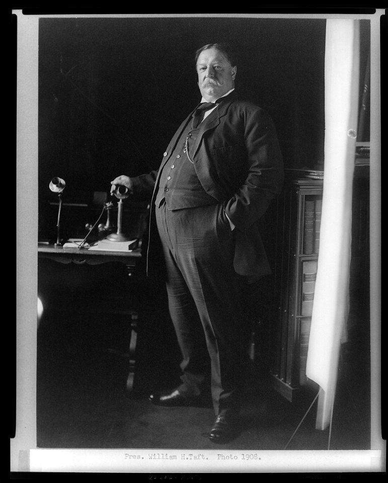 William H. Taft, full-length portrait, standing, facing left, with hand on telephone LCCN96521946