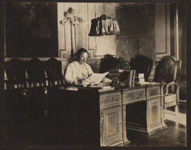 William H. Taft, Governor-General of the Philippines, seated at desk in office with map of Manila on the wall LCCN2013649078