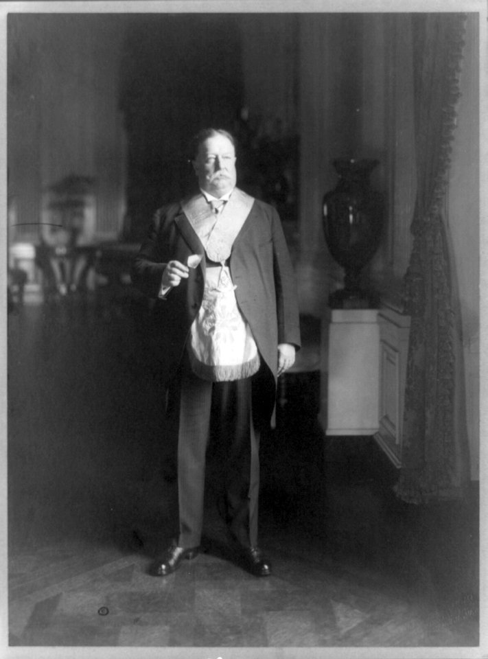 William Howard Taft, full-length portrait, standing, facing right, in a mason's garb LCCN89708458