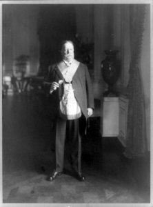 William Howard Taft, full-length portrait, standing, facing right, in a mason's garb LCCN89708458