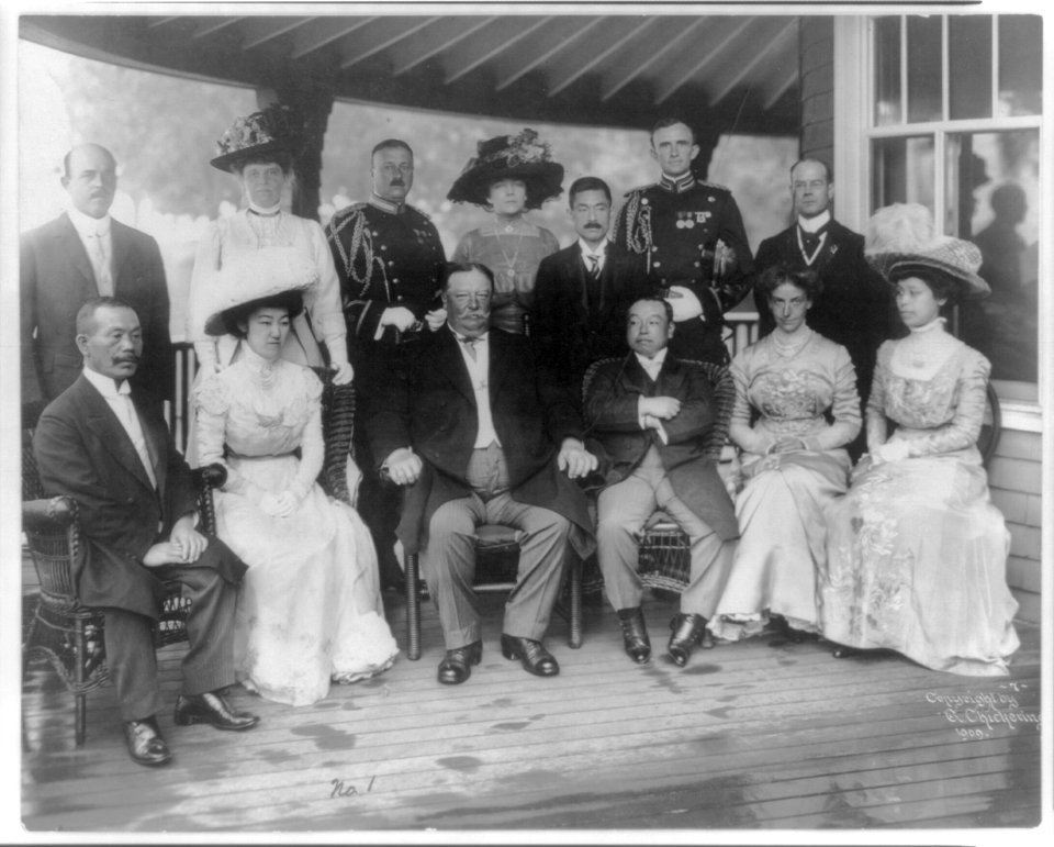 William Howard Taft, Pres. U.S., full, seated, facing slightly left, with group of Japanese and Americans, Japan LCCN2007678814