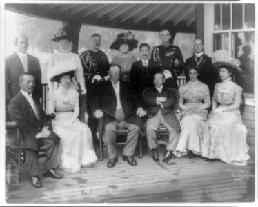 William Howard Taft, Pres. U.S., full, seated, facing slightly left, with group of Japanese and Americans, Japan LCCN2007678814