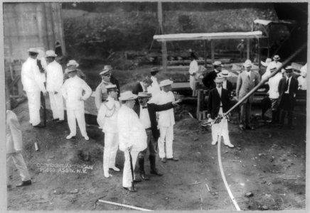 William Howard Taft, Pres. U.S., full length portrait, standing, right profile, talking to Supt. Williams at Pedro Miguel (Panama); construction site; other men in background. LCCN2005689195