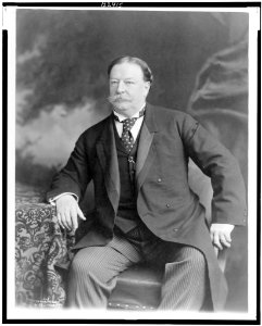 William Howard Taft, three-quarter length portrait, seated, facing slightly left LCCN99400606 photo