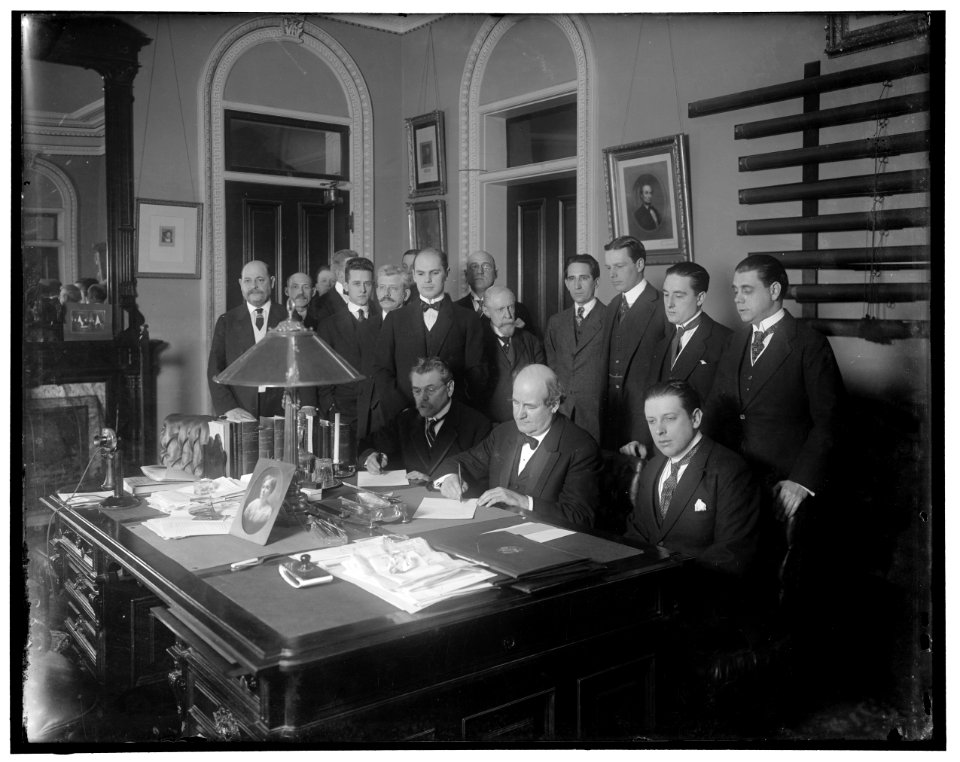 William Jennings Bryan with group at desk LOC hec.13552