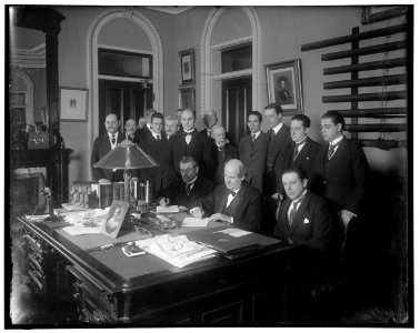 William Jennings Bryan with group at desk LOC hec.13552