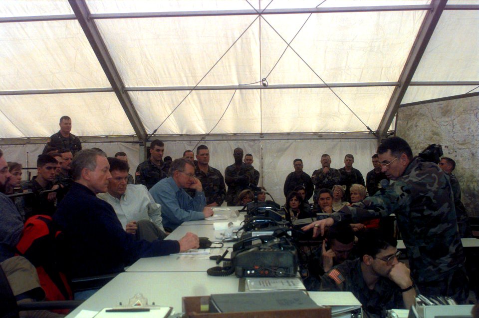 William Nash explains the communication system used to keep the Division Tactical Operation Center informed of any actions in theater to a group of senators