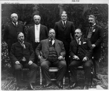William Taft and party - 3 men sitting and 4 men standing LCCN2003654857