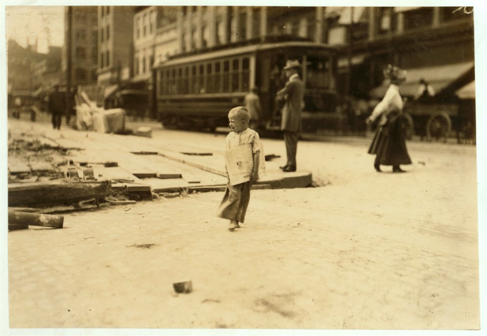 Willie --, a Richmond Va., newsboy. Told me first that he was 8, then admitted 7, and finally 6 years old. Compare 5 year old with him in photo 2210B. LOC nclc.03725