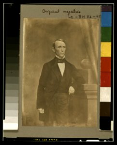 William Walker, three-quarter length studio portrait, standing, left arm resting on pedestal, facing slightly right LCCN2003663046 photo