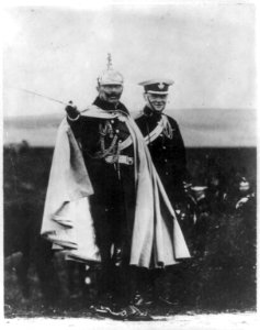 Winston Churchill with Kaiser Wilhelm at German Army maneouvers. Both standing, full lgth., in uniforms; Kaiser Wilhelm pointing with sword. LCCN2002697670