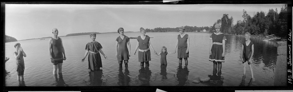 Wisconsin camp, people standing in a line in the water in bathing suits LCCN2017656439