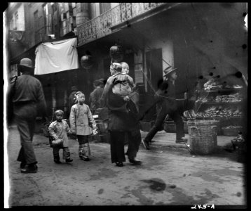 Woman and children walking down a street, Chinatown, San Francisco LOC agc.7a09023