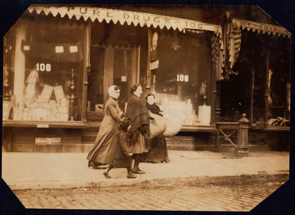 Woman and girl carrying finished couset covers made on Macdougal St.-to factory-171 Wooster Street, N.Y. LOC cph.3b01124