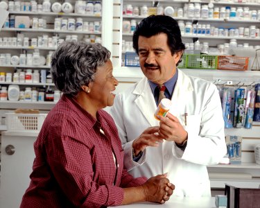 Woman consults with pharmacist (1) photo