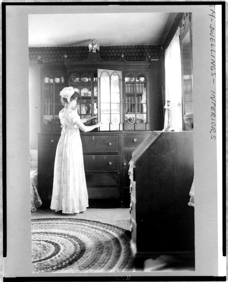 Woman at china closet, Salem, Massachusetts LCCN97506526