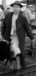 Woman detail, Woodland, California. Families of Japanese ancestry leave the station platform to board the train f . . . - NARA - 537810 (cropped)