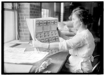 Woman holding $50 bonds, probably Liberty Bonds. Engraving and Printing, Bureau of Treasury Dept LOC hec.11329
